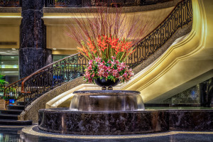 a large flower arrangement in a fountain