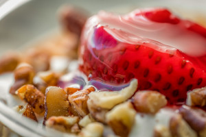 a close up of a strawberry and nuts