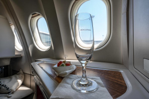 a glass on a table in an airplane