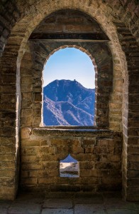 a window with a mountain in the background