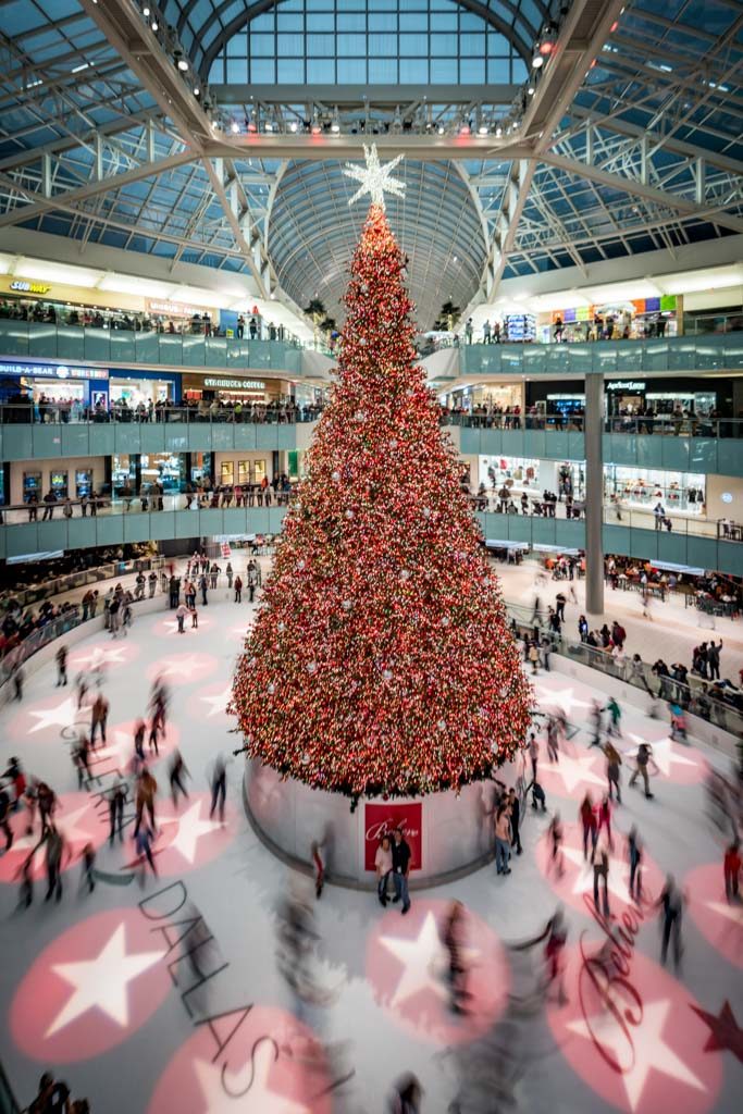 a large christmas tree in a mall