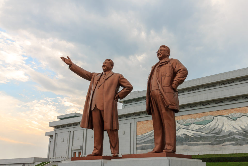 a statue of two men in suits