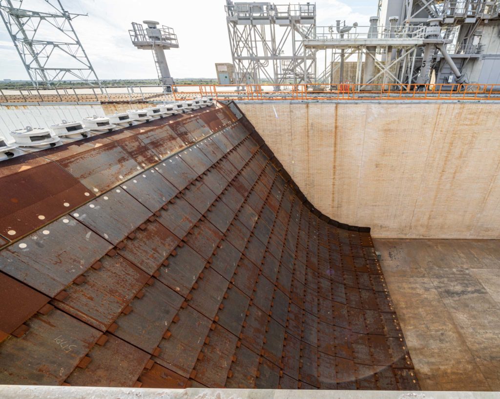 a large metal dam with a large metal structure