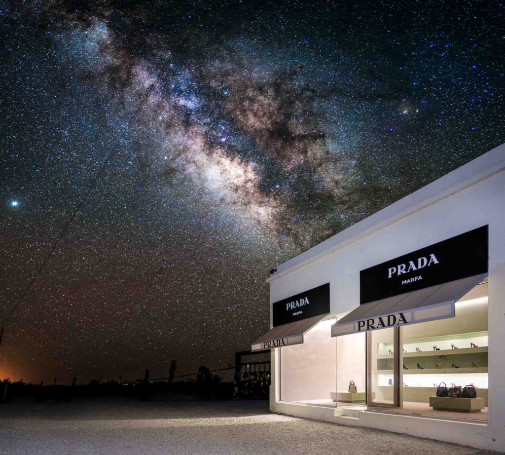 a store front with a starry sky in the background