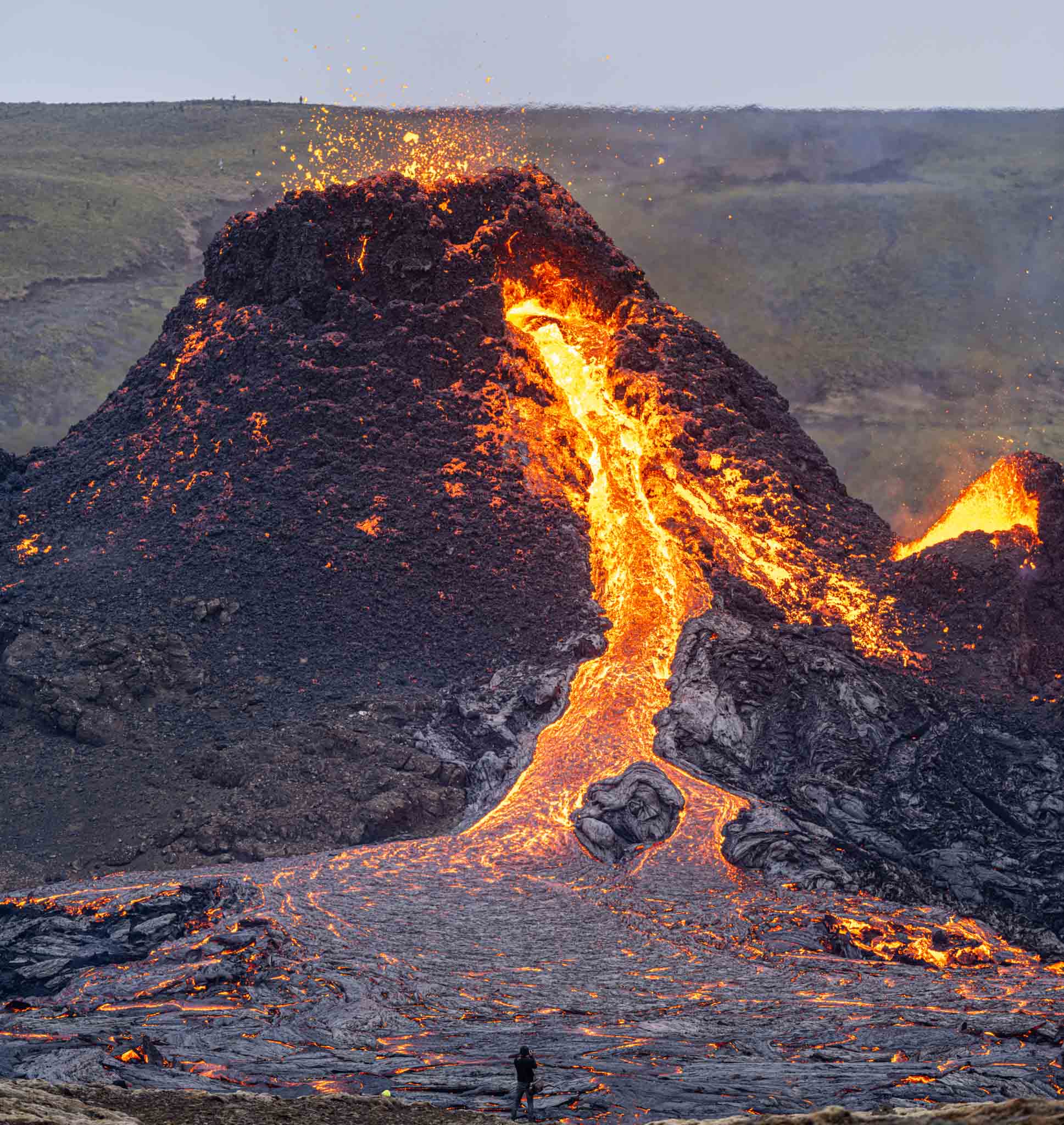 a volcano erupting with lava coming out of it