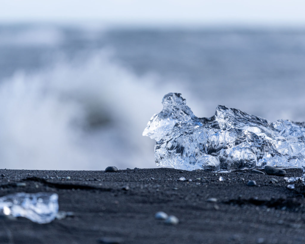 a piece of ice on a beach