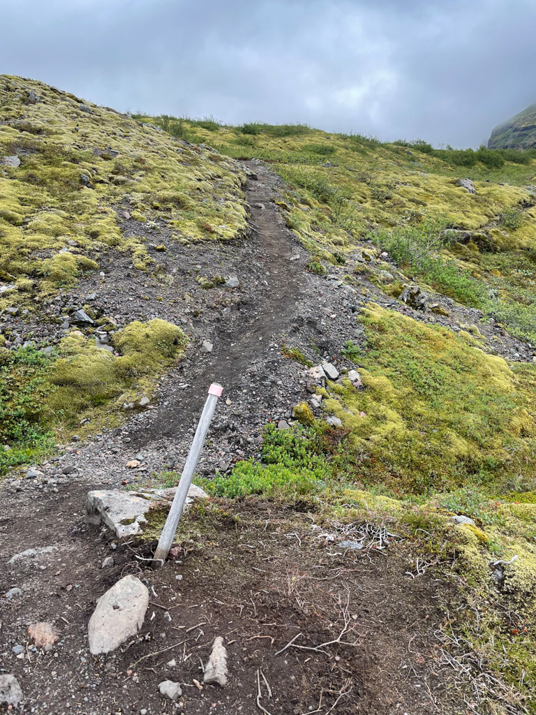 a dirt path on a hill