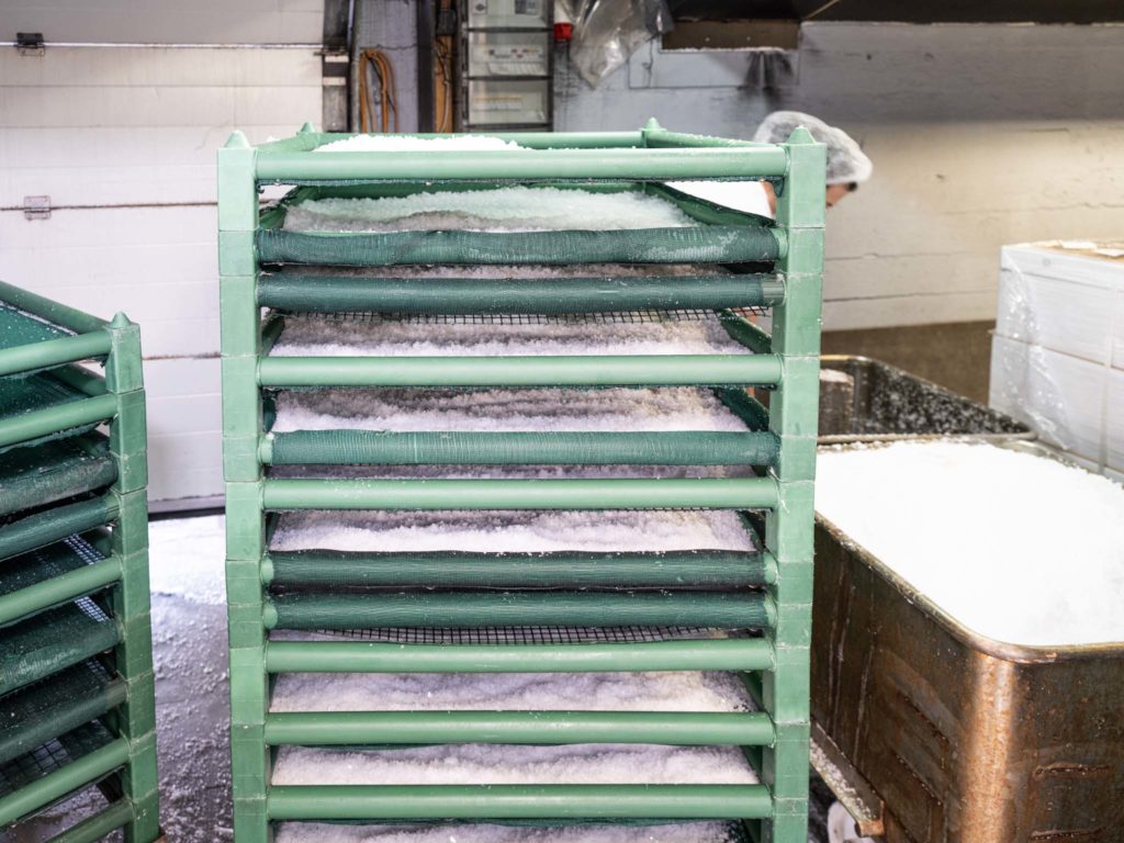 a green rack with white material in it