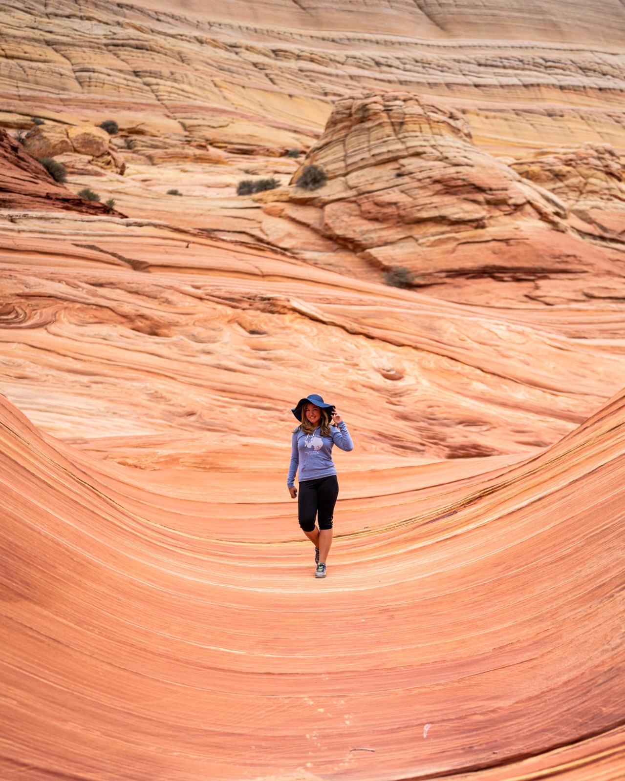 a woman walking on a desert