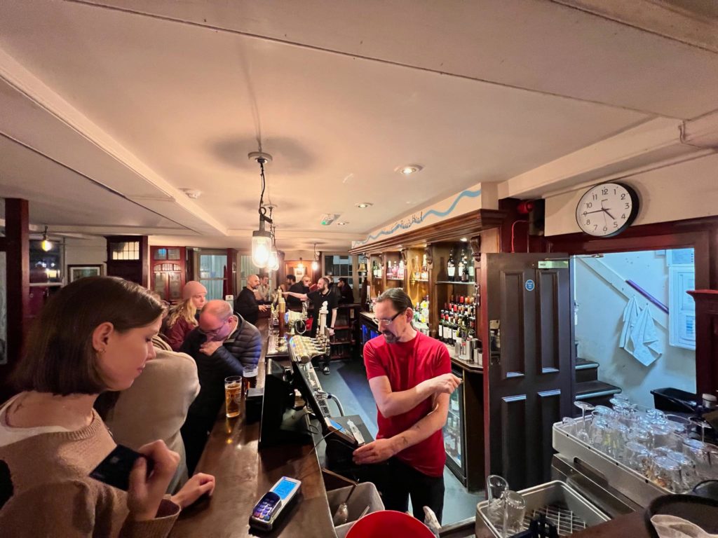 a group of people in a bar