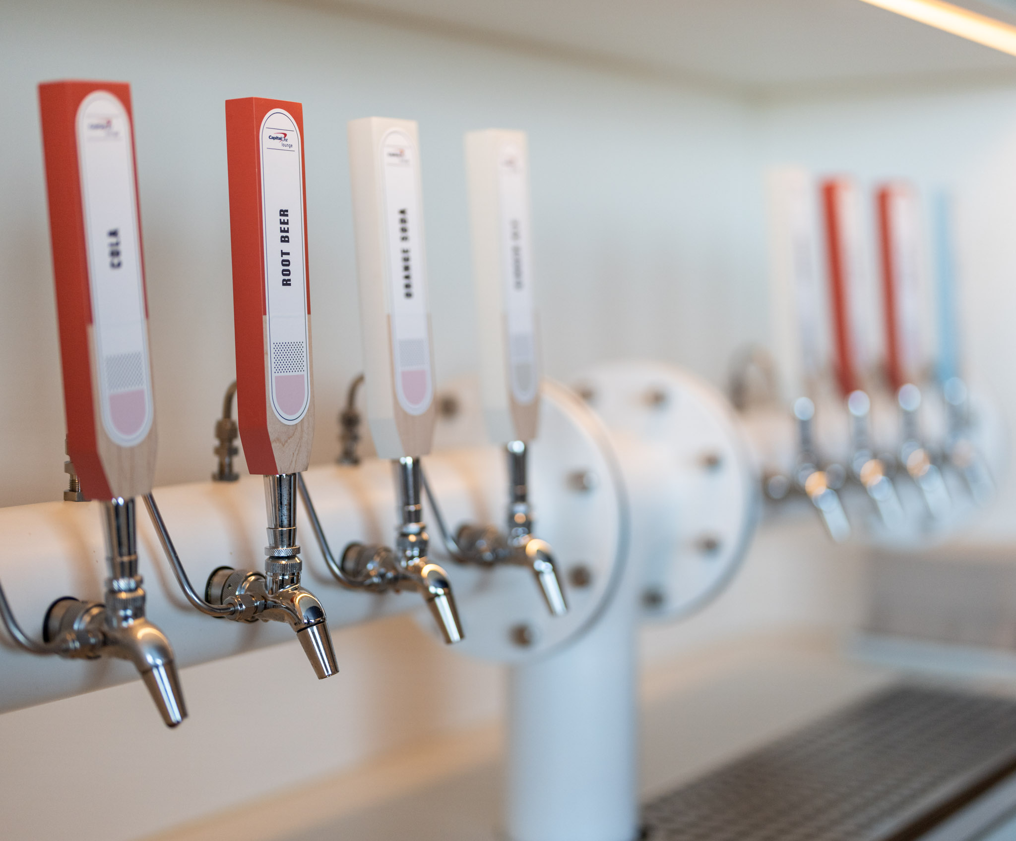 a row of taps of beer
