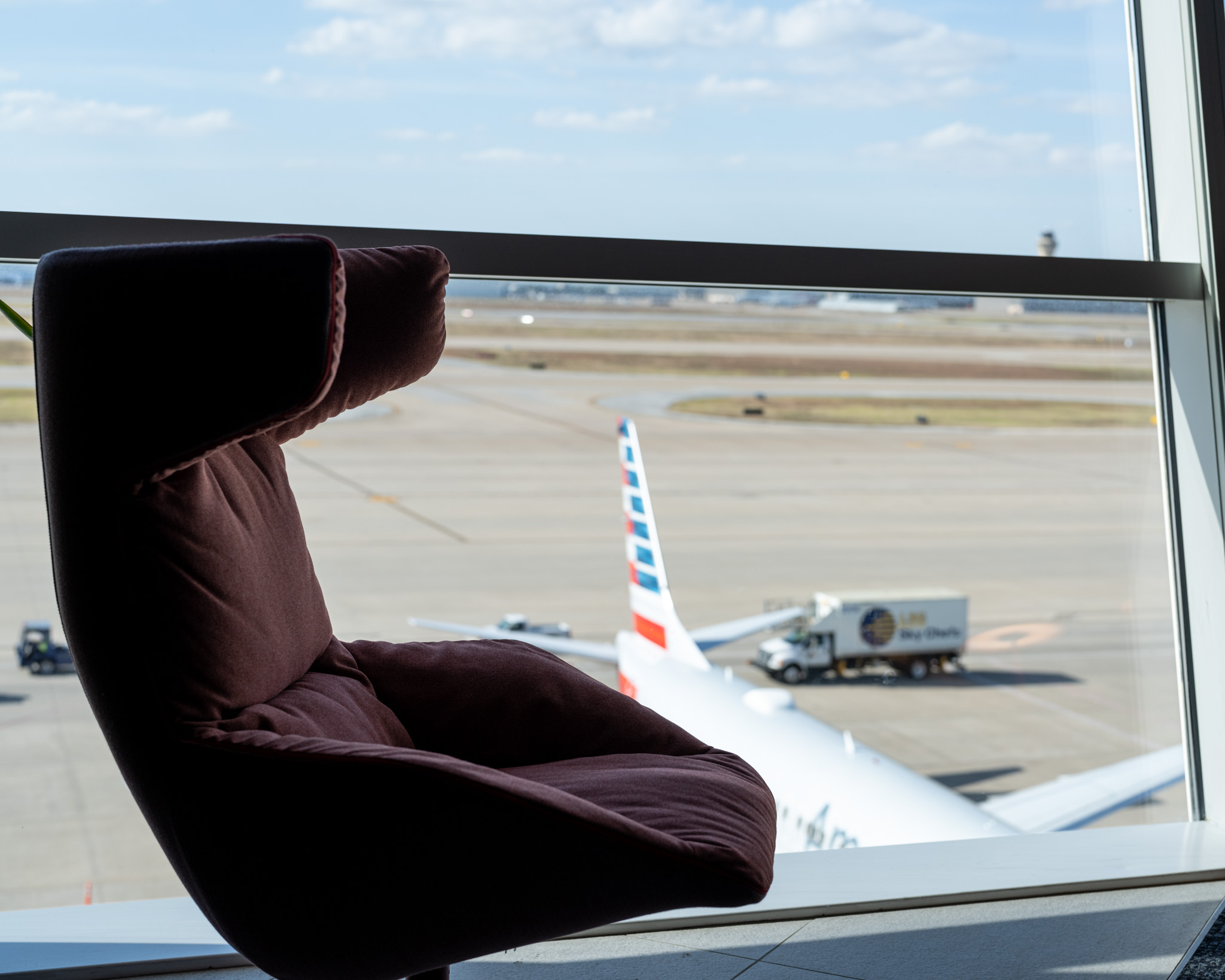 a chair in front of an airplane