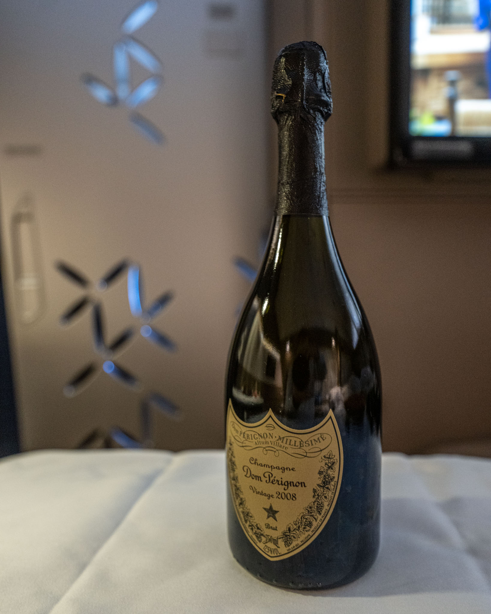 a bottle of champagne on a table
