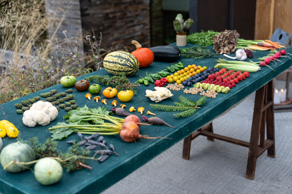 a table with vegetables and fruits on it