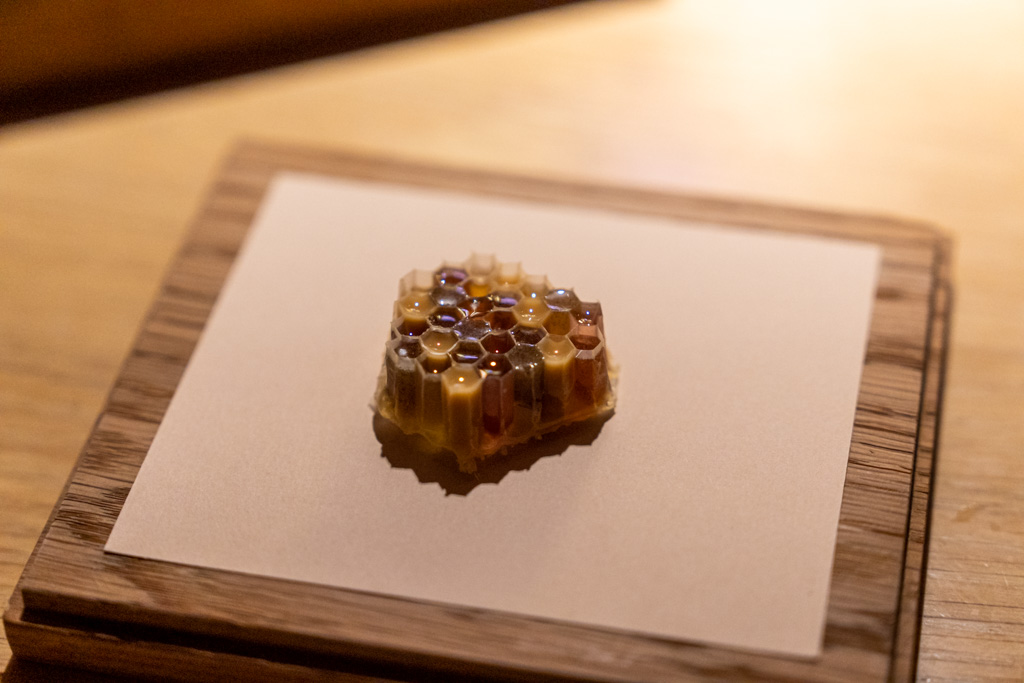 a honeycomb shaped object on a piece of paper