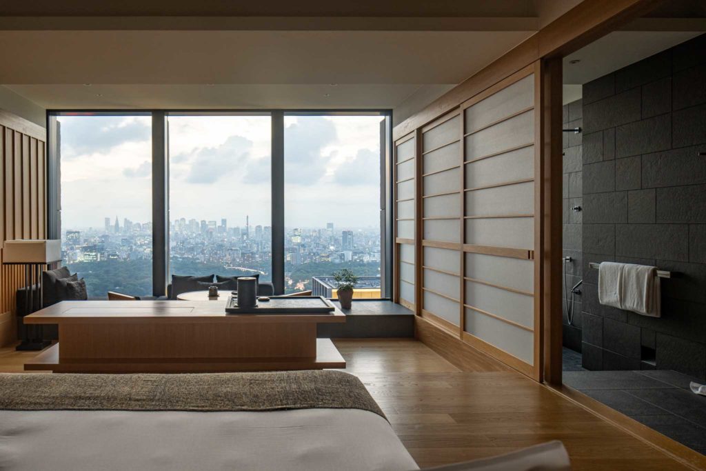a room with a large window and a city view