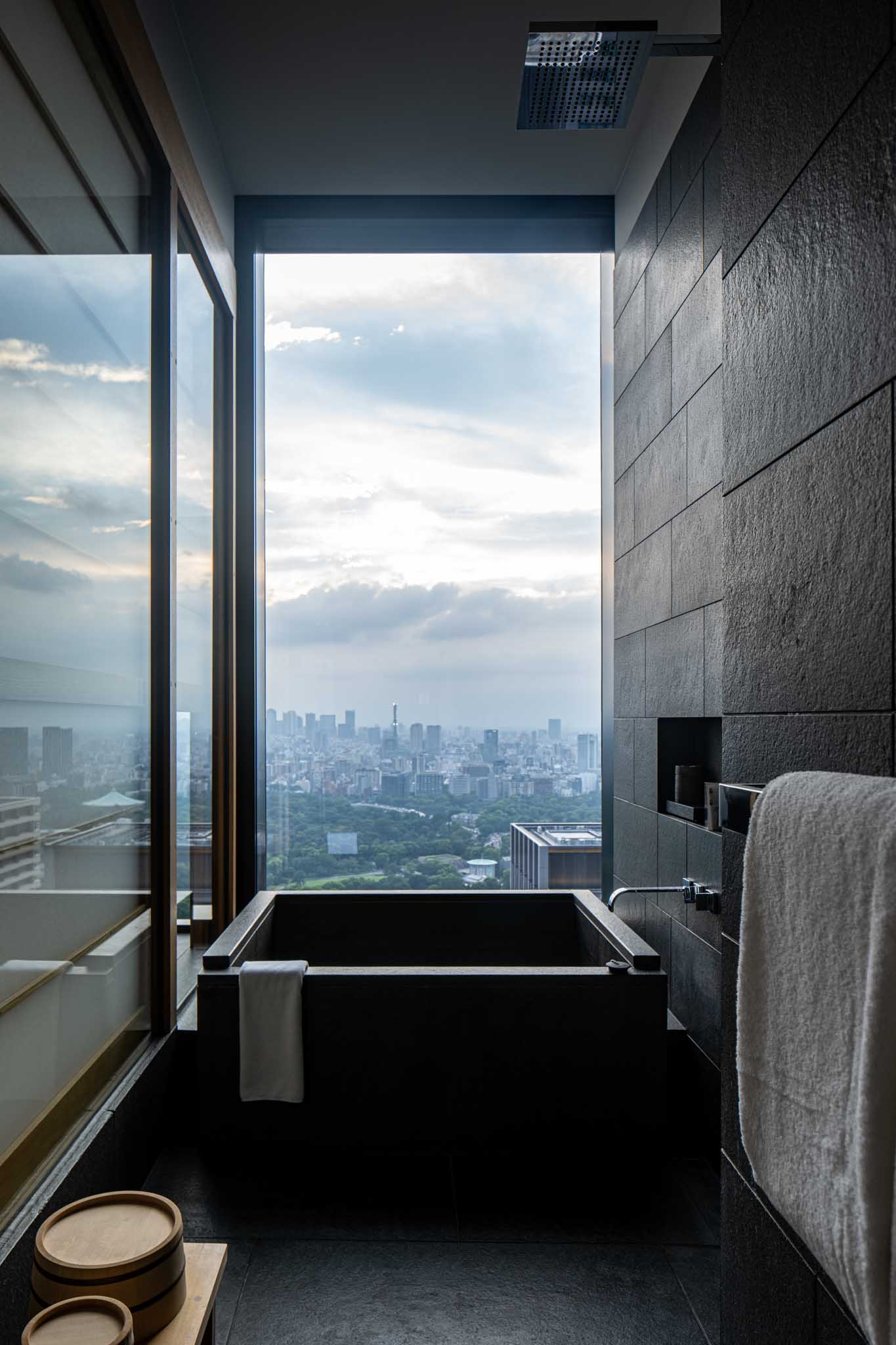 a bathroom with a view of a city