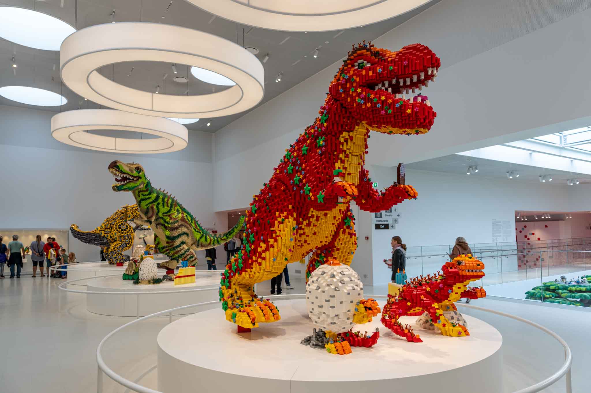a group of dinosaurs made out of lego blocks