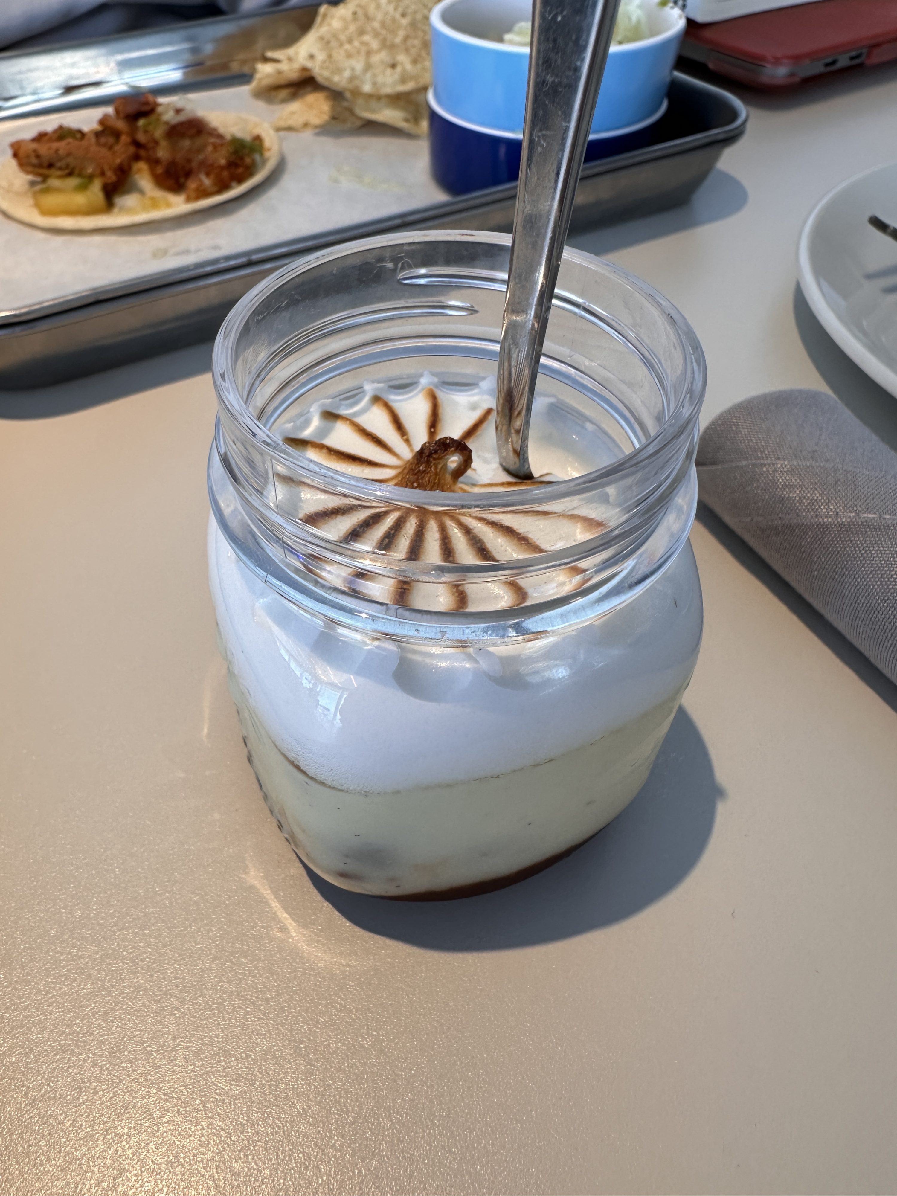 a glass jar with a spoon in it