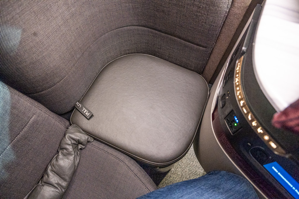 a leather seat cushion on a car