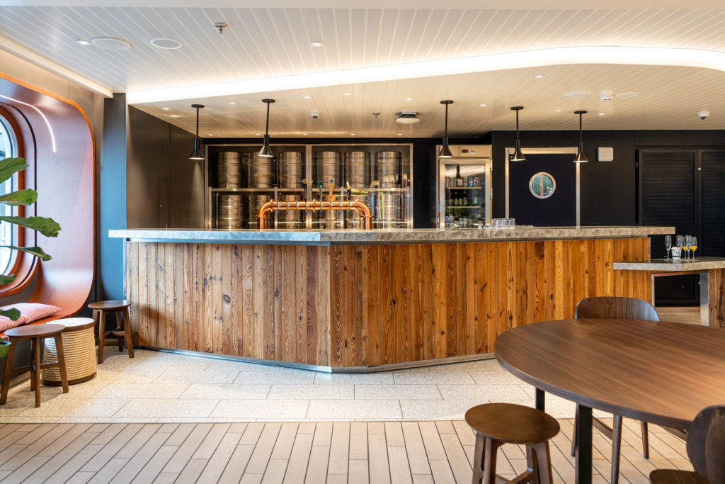 a bar with a wooden counter and a table