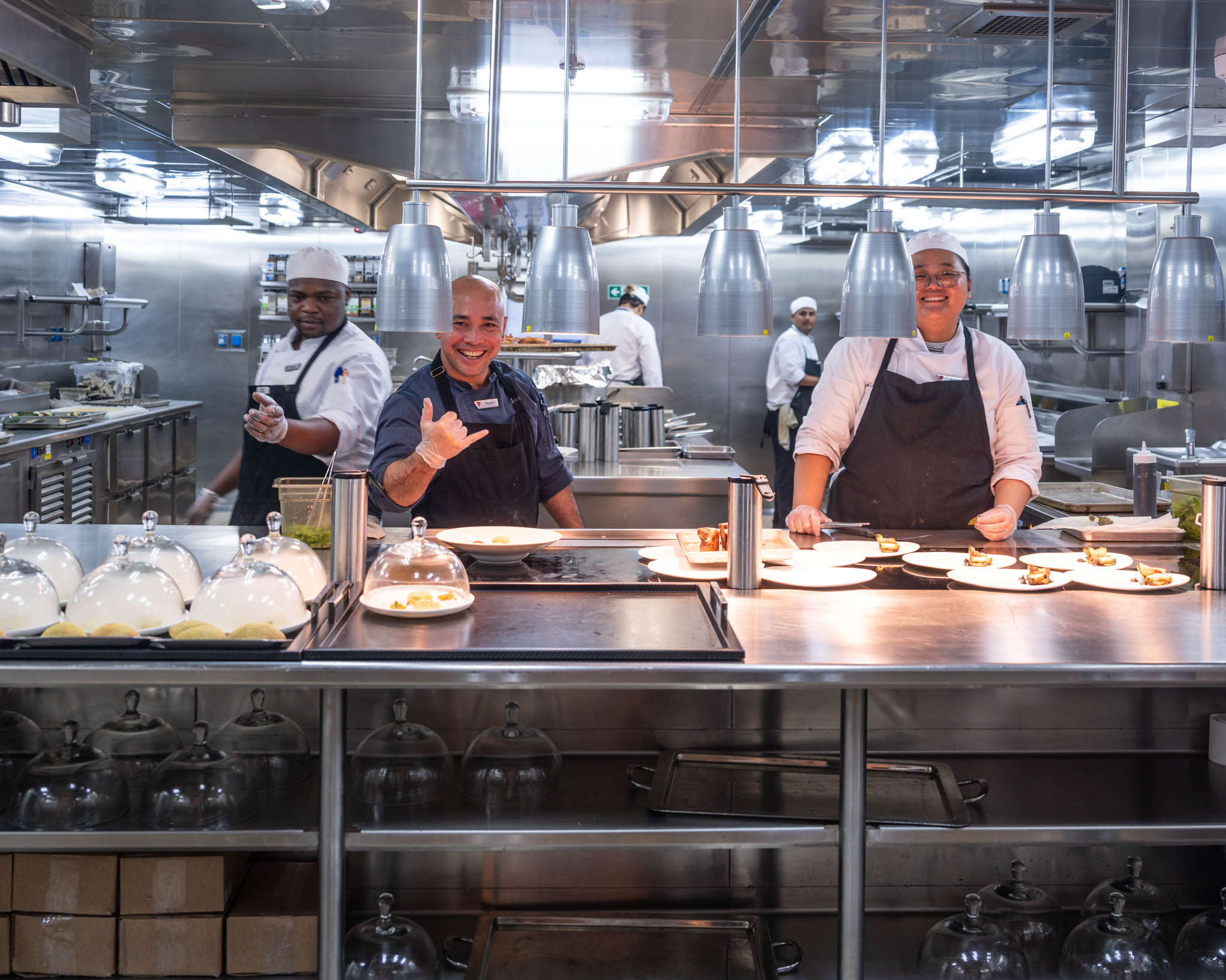 a group of chefs in a kitchen