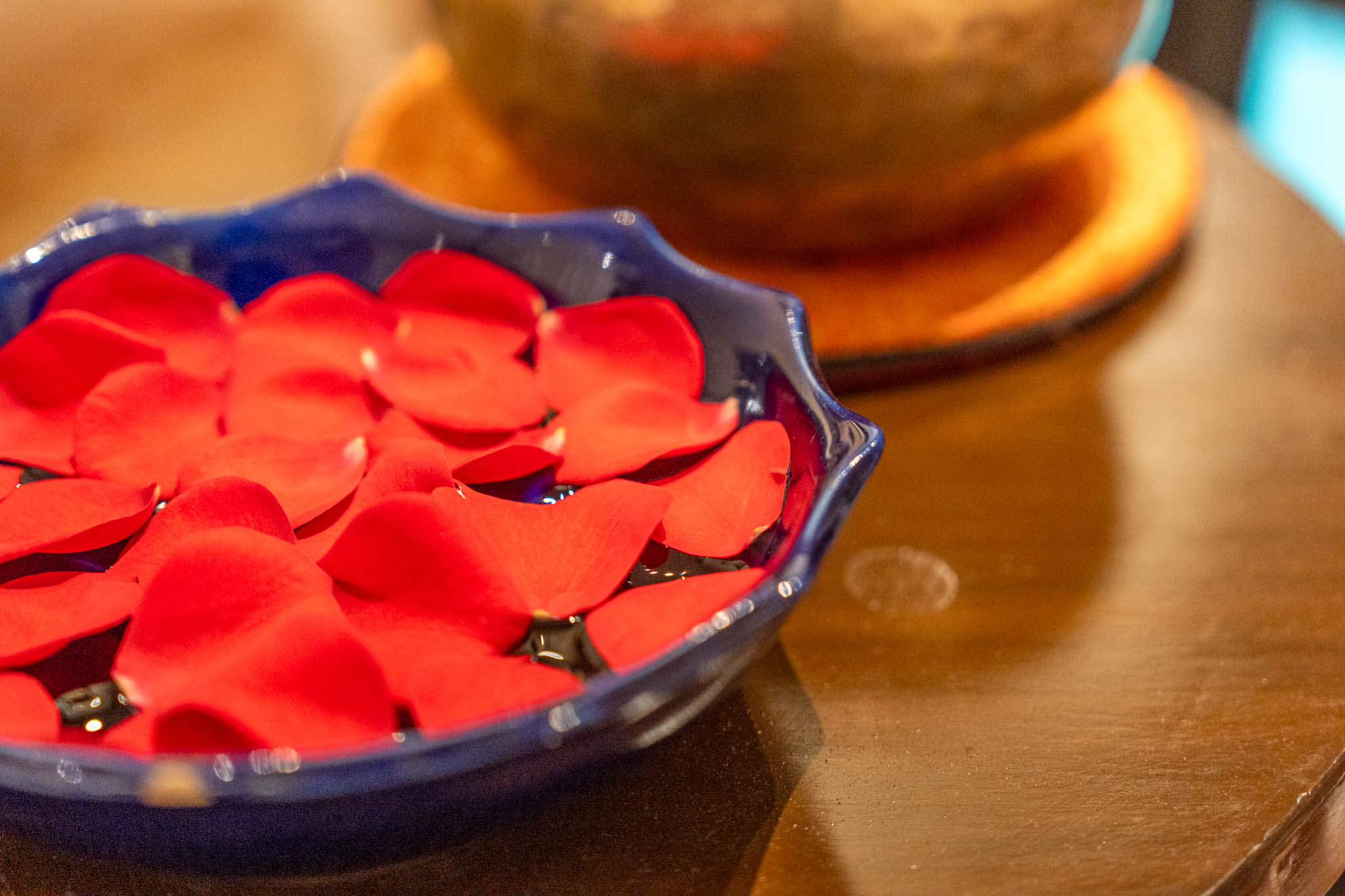 a bowl of red petals