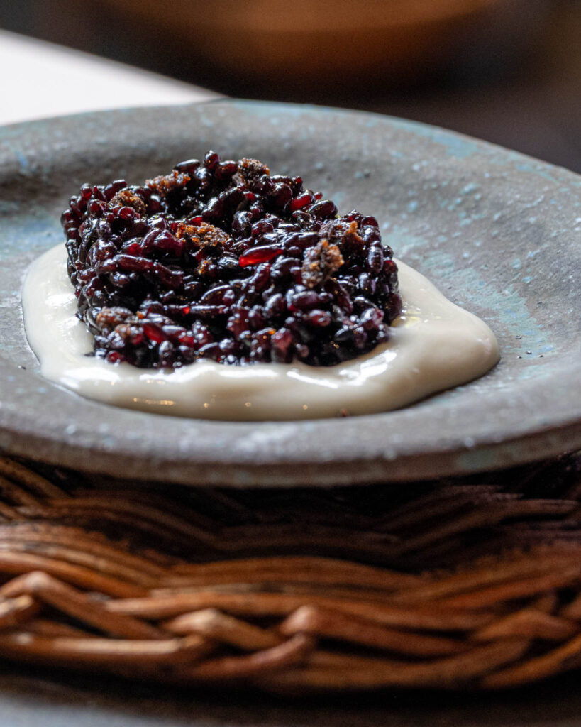 a plate of food on a wicker surface