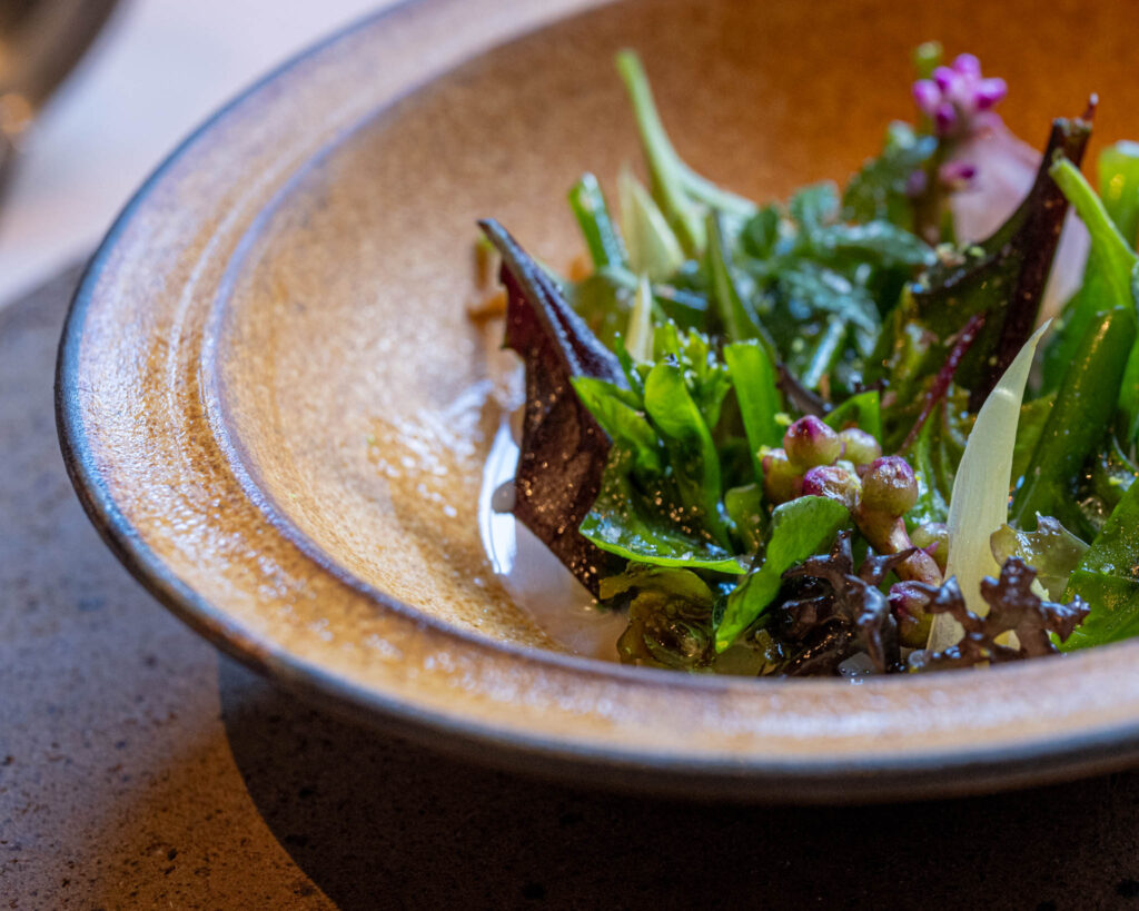 a bowl of salad on a table