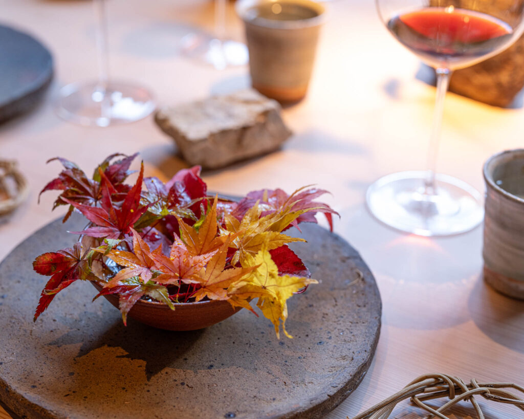 a bowl of leaves on a table