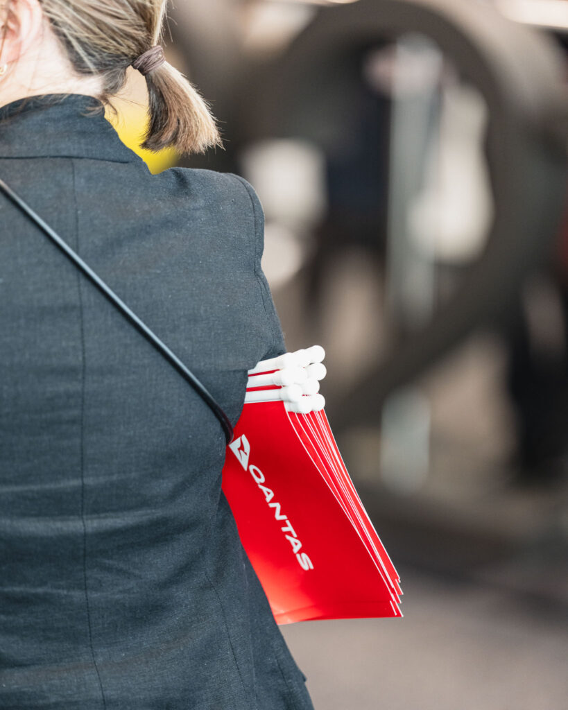 a woman carrying a red bag