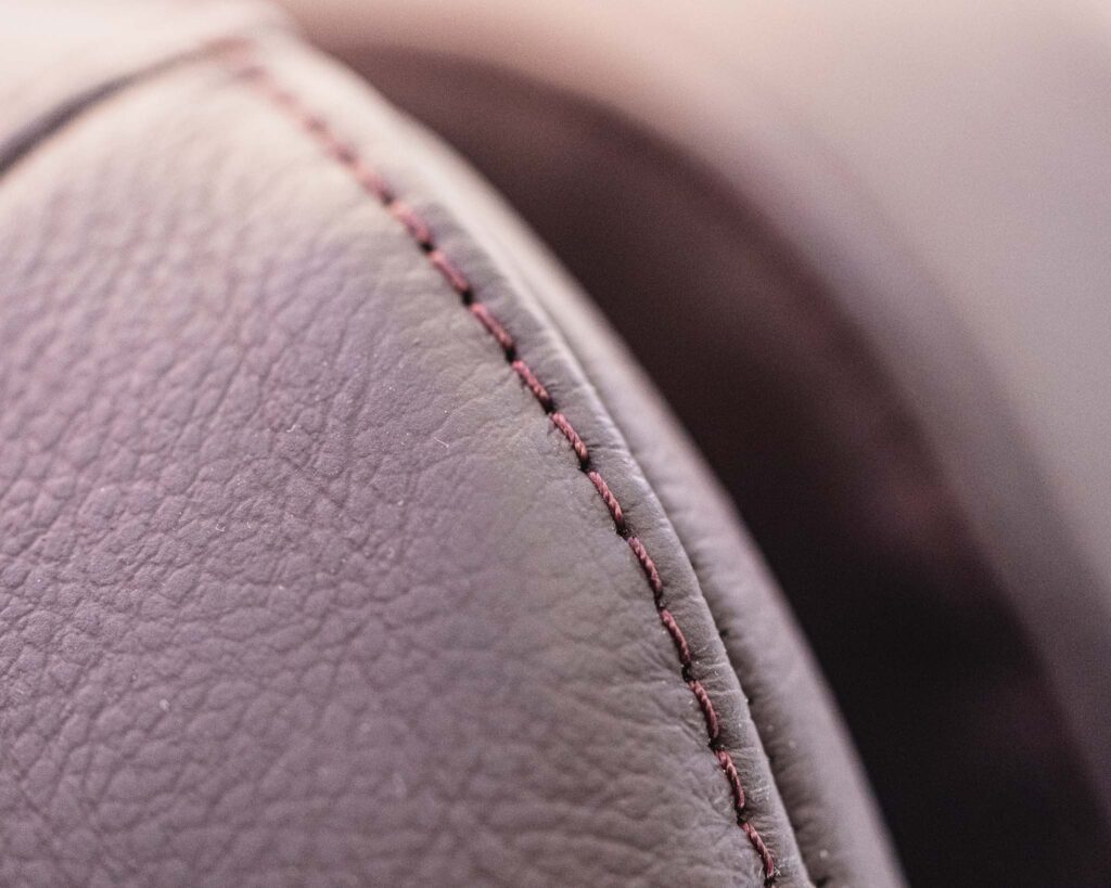 a close up of a stitched leather surface