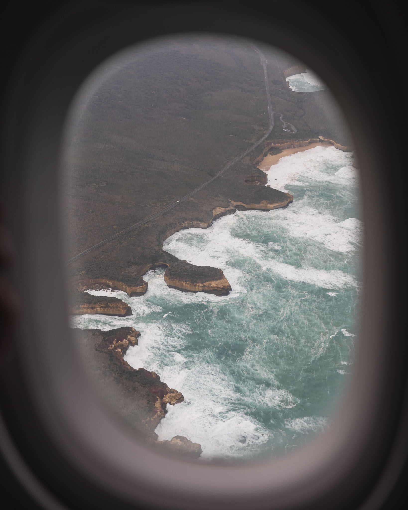 a view of the ocean from an airplane window