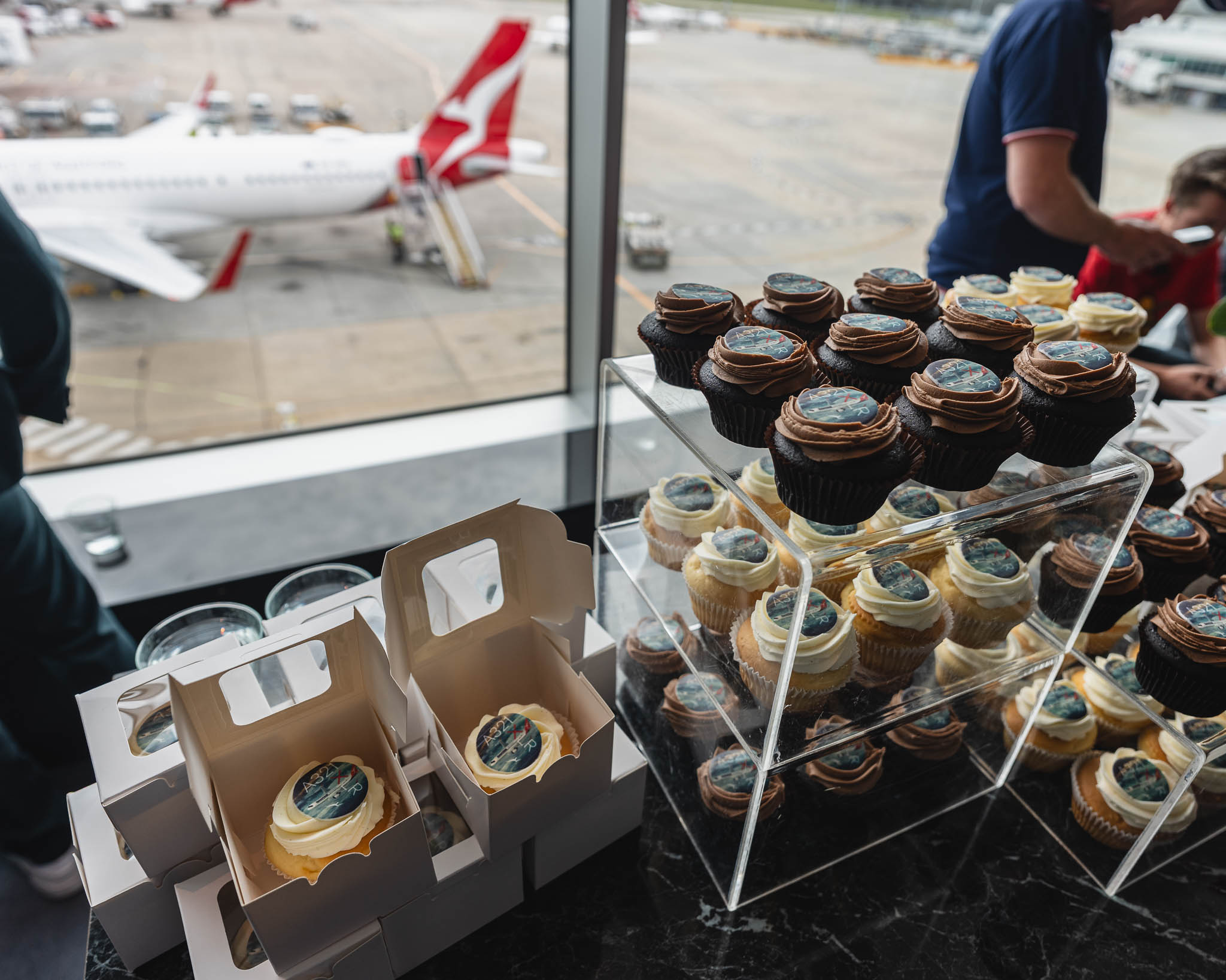 a display of cupcakes and other desserts