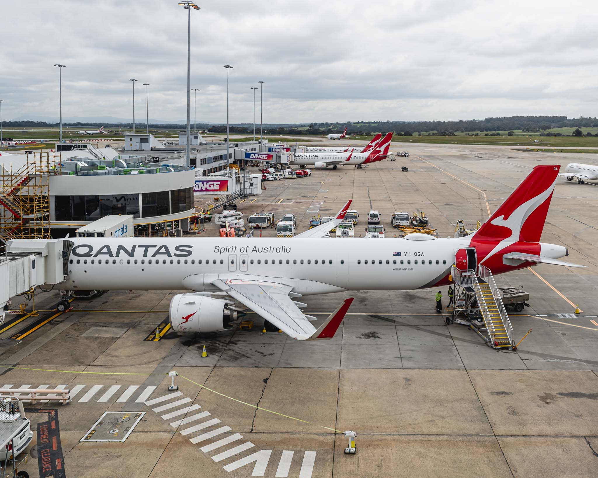 a group of airplanes at an airport