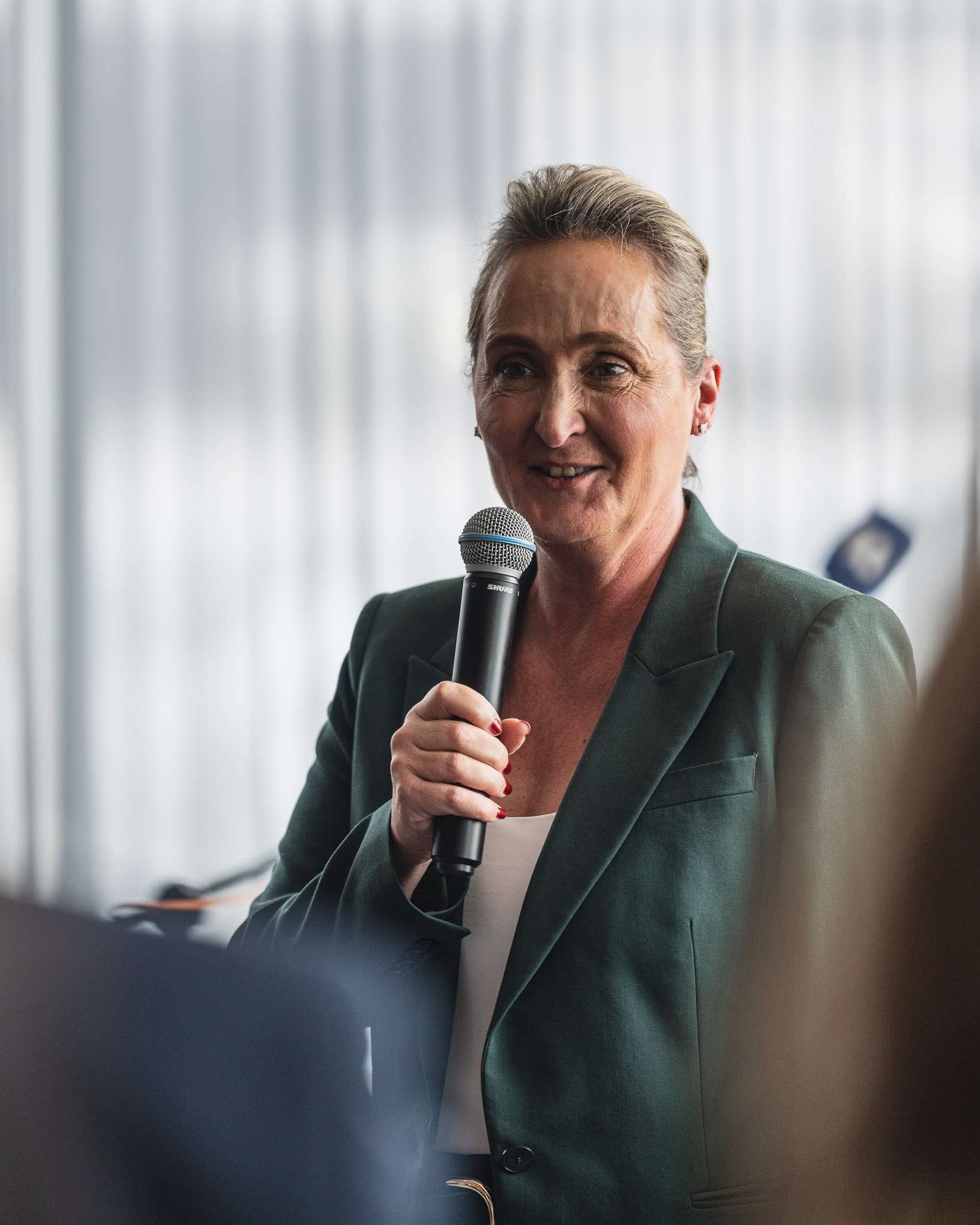 a woman holding a microphone