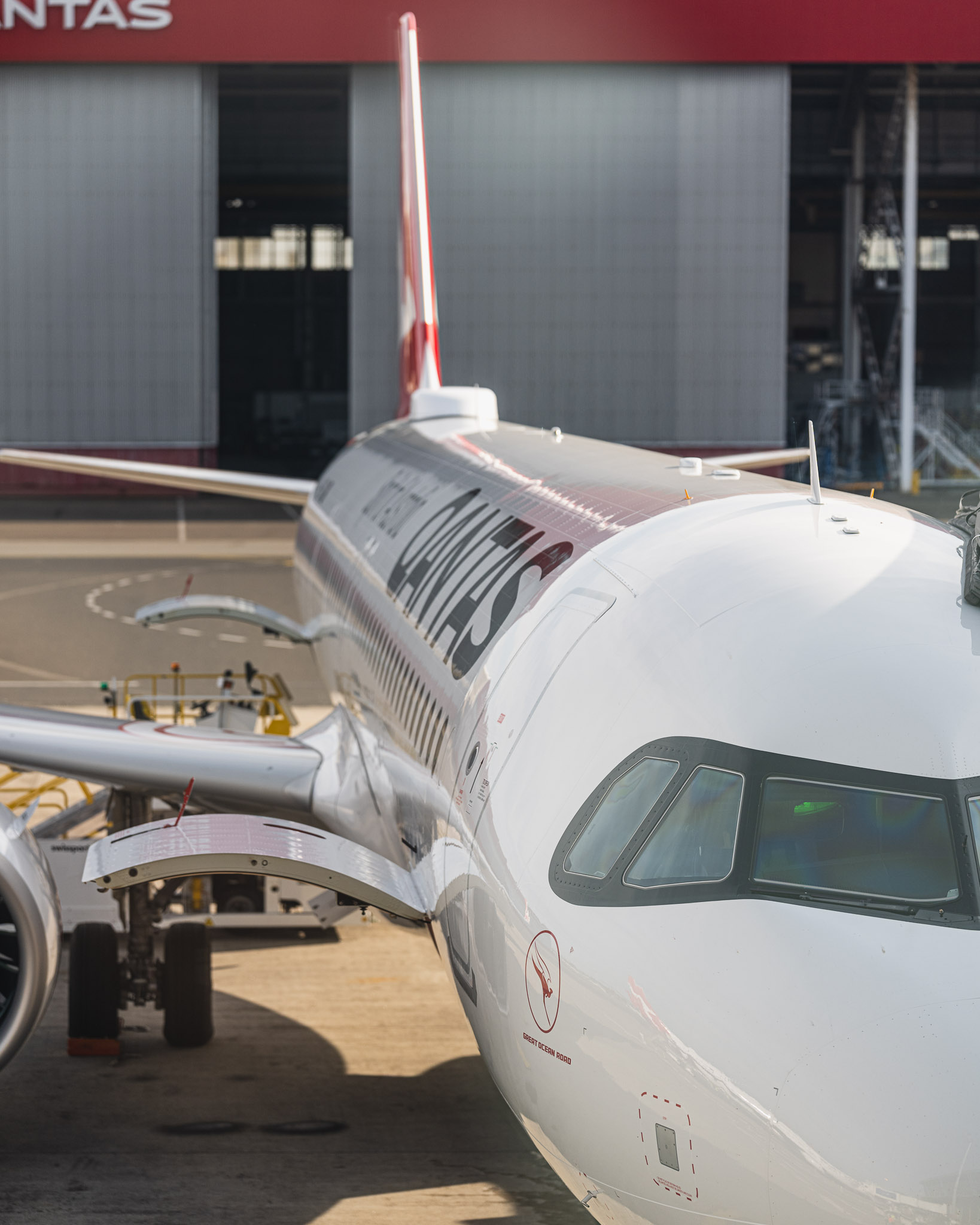 a white airplane parked on a tarmac