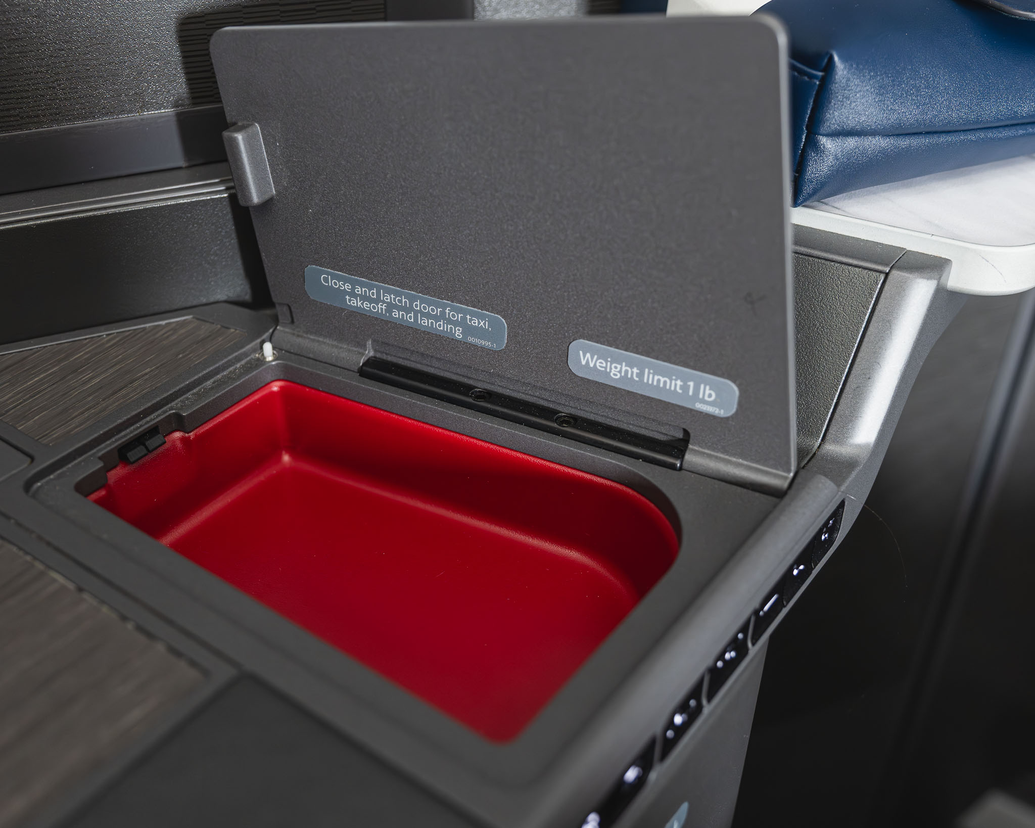 a red and black object with a rectangular object in the middle